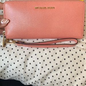Coral colored Michael Kors wallet/wristlet
